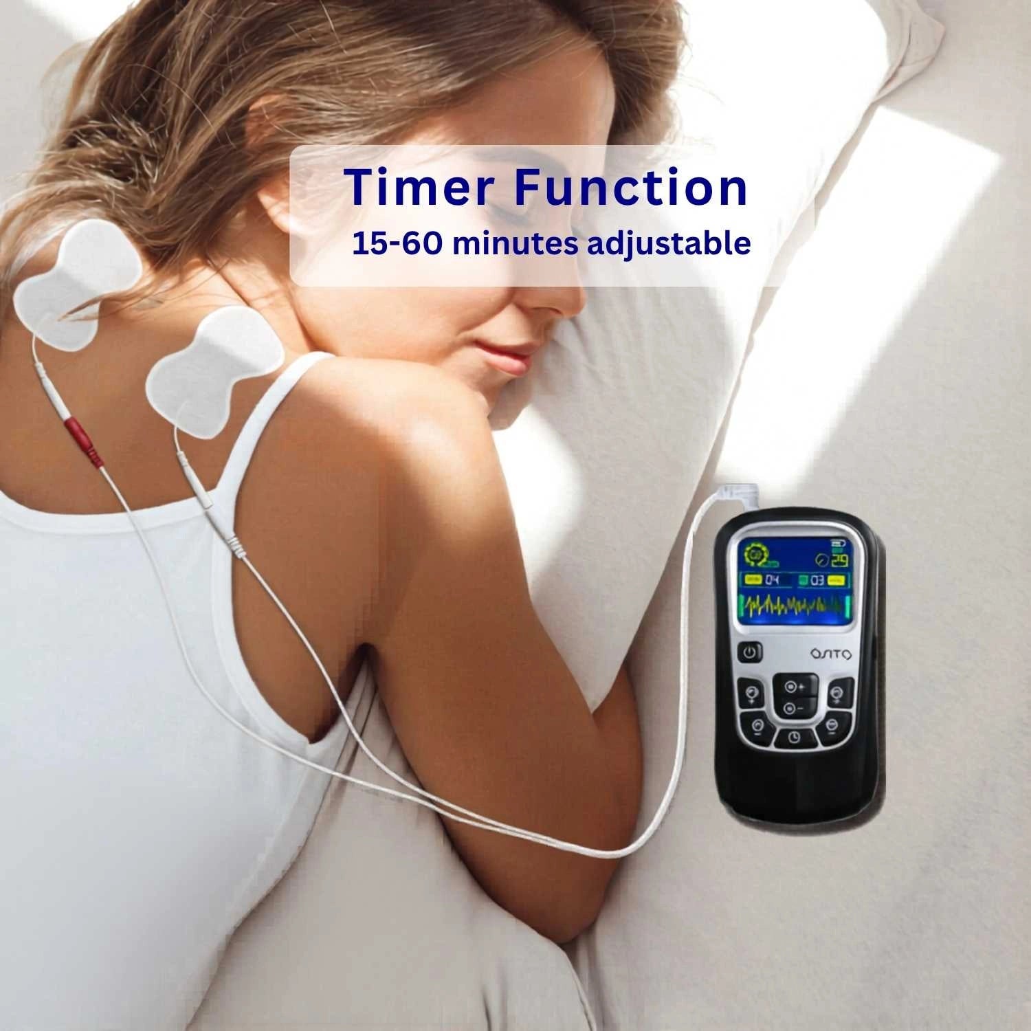 Woman receiving electrical stimulation therapy with a digital controller, emphasizing timer function. Volta TENS Unit EMS Machine by Revital Motion